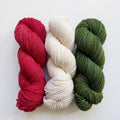 Red, white and green hanks of yarn from Muse2320
